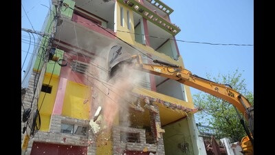 An illegal construction being demolished by the Lucknow Development Authority on Campbell road in Lucknow on Wednesday. (Deepak Gupta/HT Photo)
