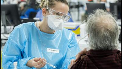 A healthcare worker administers a Covid-19 vaccine at the Decarie Square vaccination site in Montreal, Quebec, Canada. (Bloomberg) A healthcare worker administers a Covid-19 vaccine at the Decarie Square vaccination site in Montreal, Quebec, Canada. (Bloomberg)