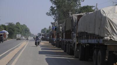 Gurgaon, India- Ocotber 19 : Trailers drivers parked all along the stretch take up much of the road space at Pataudi road,in Gurgaon, India, on Saturday, October 19, 2013.(Pic to go with road package story) (Photo by Parveen Kumar/Hindustan Times)