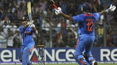 MS Dhoni hits the winning runs of 2011 World Cup as Yuvraj Singh watches (AFP)