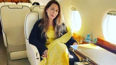 This photo of Farah Khan, aide of Imran Khan's wife Bushra Bibi, sitting on a plane has gone viral. This photo of Farah Khan, aide of Imran Khan's wife Bushra Bibi, sitting on a plane has gone viral. 