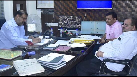 Chief vigilance officer Rajiv Sekhri, along with other officials, inspecting the records at Ludhiana Improvement Trust (LIT) office in Ludhiana on Wednesday. (Gurpreet Singh/HT)