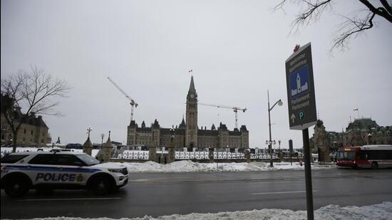 A police vehicle drives past Parliament Hill in Ottawa, Ontario, Canada. (Bloomberg)