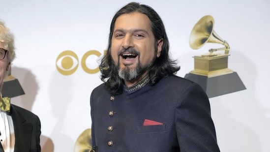 Ricky Kej poses in the press room with the award for best new age album for Ricky Kej poses in the press room with the award for best new age album for