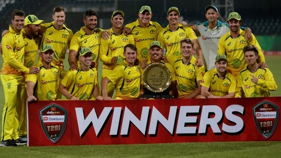 Australian players pose for photograph with trophy after winning the Twenty20 cricket match against Pakistan at the Gaddafi Stadium in Lahore, Pakistan, Tuesday, April 5, 2022.(AP)