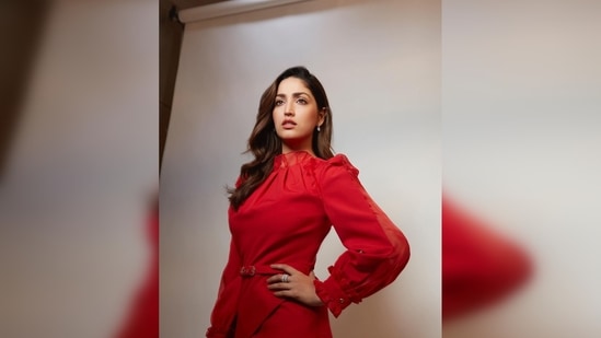 The asymmetrical red top featured long ruffled sleeves and a waist belt.(Instagram/@yamigautam)