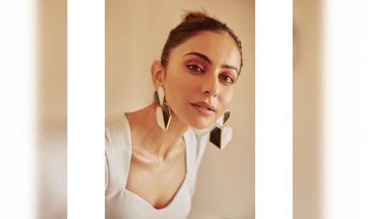Rakul Preet teamed her look with black and white big and bold earrings.(Instagram/@rakulpreet)