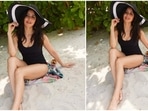 Katrina Kaif and Vicky Kaushal were recently vacationing in an undisclosed beach destination and have been sharing glipmse of their stay on social media. The Bharat actor recently took to her Instagram handle to share a slew of photos of herself in a black monokini and black and white sun hat.(Instagram/@katrinakaif)