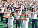 Lok Sabha Speaker Om Birla and Union Minister Sarbananda Sonowal participate in the 'Yoga Utsav' perform exercises at Red Fort. 