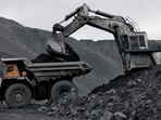 A machine loads a BelAZ dump-body truck with coal at the Chernigovsky opencast colliery, outside the town of Beryozovsky, Kemerovo region, Siberia, Russia, April 4, 2016. REUTERS/Ilya Naymushin/File Photo