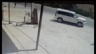 A CCTV footage of persons opening fire at a vehicle on Talwandi Road on the outskirts of Faridkot city.