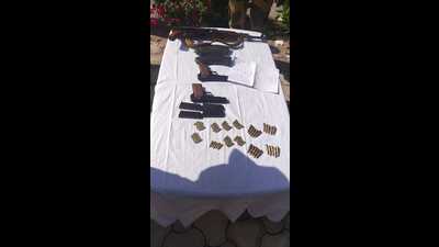 The arms and ammunition that were recovered by BSF along the Indo-Pak border in Jammu.