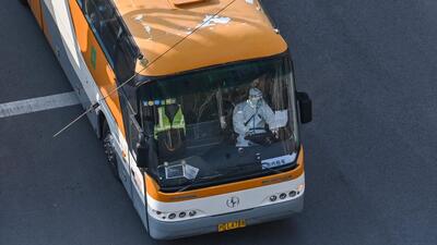 A man wearing personal protective equipment (PPE) drives a bus on a street during a COVID-19 lockdown in the Jing'an district in Shanghai on Thursday. (AFP) A man wearing personal protective equipment (PPE) drives a bus on a street during a COVID-19 lockdown in the Jing'an district in Shanghai on Thursday. (AFP)