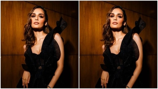 Manushi's stain black midriff-baring gown came with laced dramatic sleeves and a golden buckle detail at the waist. The long gown made Manushi look right out of a dream.(Instagram/@manushi_chhillar)