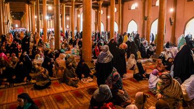 Muslim devotees offer Friday prayers during the holy fasting month of Ramzan at Jamia Masjid in Srinagar on Friday. (AFP)