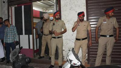 Cops investigating the robbery spot in Ludhiana on Friday. (HT Photo)