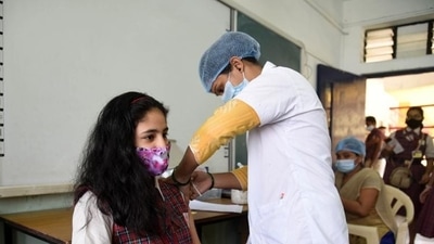 A beneficiary being inoculated against Covid-19 during a special vaccination drive by Navi Mumbai Municipal Corporation on Tuesday. (Bachchan Kumar/Ht Photo) A beneficiary being inoculated against Covid-19 during a special vaccination drive by Navi Mumbai Municipal Corporation on Tuesday. (Bachchan Kumar/Ht Photo)