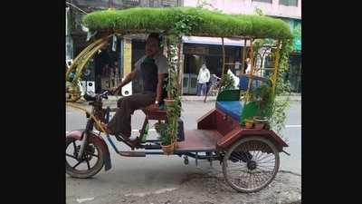 The image posted on Twitter which shows a man riding a rickshaw with a mini garden on the roof. (Twitter/@ErikSolheim)