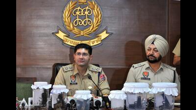 Senior superintendent of police Vivek Sheel Soni showing the weapons seized from gangster Harbir Singh Sohal, at a press conference in Mohali on Friday. (Ravi Kumar/HT)