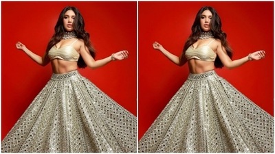 Styled by fashion stylist Manisha Melwani, Bhumi wore her long tresses open in wavy curls with a middle part. (Instagram/@bhumipednekar)