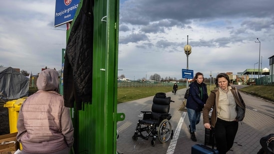 Refugees from Ukraine are seen at the Polish/Ukrainian border crossing in Medyka on April 7, 2022.(AFP)