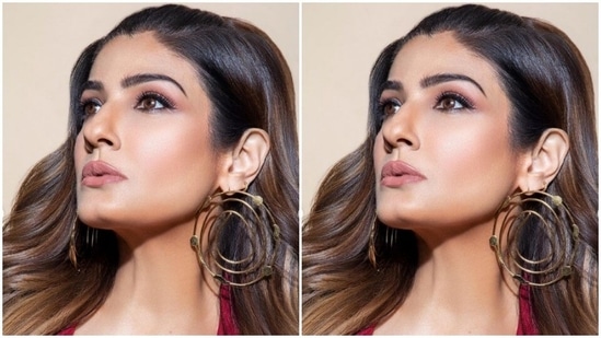 Styled by fashion stylist Surina Kakkar, Raveena wore a part of her pair into a ponytail and left the rest of the tresses open in wavy curls around her shoulders.(Instagram/@officialraveenatandon)