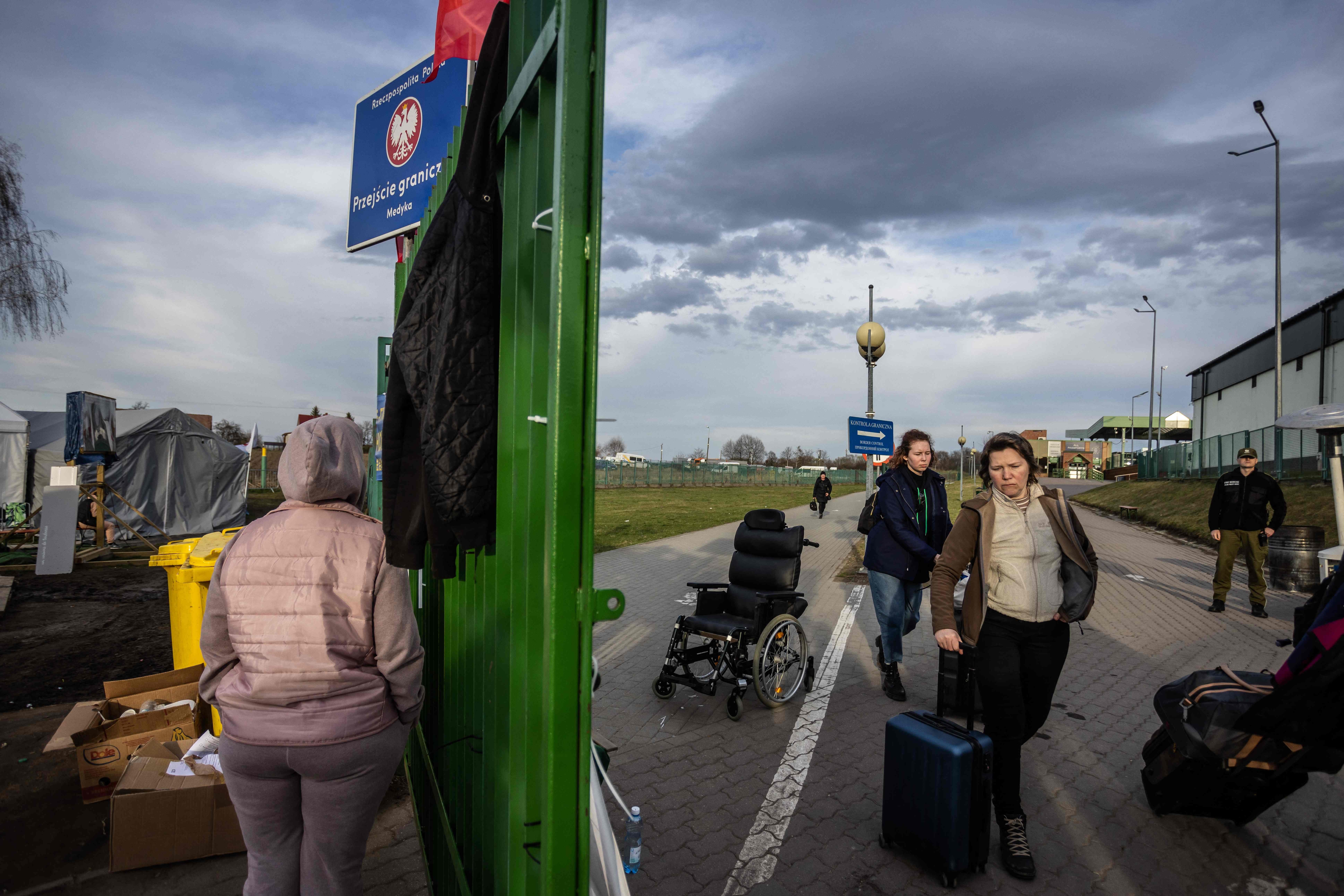 Refugees from Ukraine are seen at the Polish/Ukrainian border crossing in Medyka on April 7, 2022. (AFP) Refugees from Ukraine are seen at the Polish/Ukrainian border crossing in Medyka on April 7, 2022. (AFP)