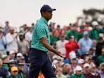 Tiger Woods watches his putt on the 18th hole during the second round at the Masters golf tournament Tiger Woods watches his putt on the 18th hole during the second round at the Masters golf tournament