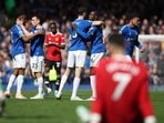 Everton's Abdoulaye Doucoure celebrates with Michael Keane, Seamus Coleman and Alex Iwobi after the match.