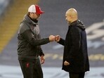 Manchester City manager Pep Guardiola and Liverpool manager Juergen Klopp bump fists after a match(REUTERS/File)