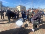 In this image shared by Ukrainian journalist Kristina Berdynskykh, residents of a village in Ukraine's Kyiv region can be seen using mobile phones to access internet via Starlink. In this image shared by Ukrainian journalist Kristina Berdynskykh, residents of a village in Ukraine's Kyiv region can be seen using mobile phones to access internet via Starlink.