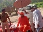 Women and children around him clapped as the Mahanta Bajrang Muni Das issued rape threats to Muslim women. Women and children around him clapped as the Mahanta Bajrang Muni Das issued rape threats to Muslim women.
