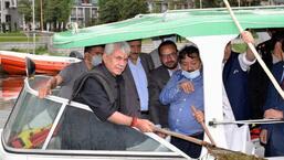 J&K Lieutenant Governor Manoj Sinha removes weed from Dal Lake in Srinagar on Saturday (ANI)