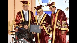 Haryana Chief Minister Manohar Lal Khattar conferred a degree on a student during the 11th Annual Convocation of the Indian Institute of Management in Rohtak on Saturday.  (Manoj Dhaka / HT)