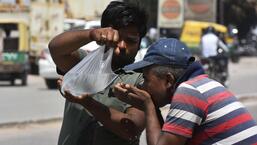 Gurugram, India - April 09, 2022: A man drinks water from a plastic bag on a hot summer day, in Gurugram, India, on Saturday, April 09, 2022. (Photo by Vipin Kumar/ Hindustan Times) (Vipin Kumar/HT PHOTO)
