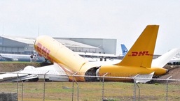 Smoke was billowing from the bright yellow plane of German logistics giant DHL as it ground to a halt.