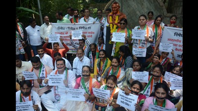 Nationalist Congress Party (NCP) workers stage a silent protest in support of party chief Sharad Pawar, after MSRTC employees' protested outside his Silver Oak residence (Praful Gangurde/HT Photo) Nationalist Congress Party (NCP) workers stage a silent protest in support of party chief Sharad Pawar, after MSRTC employees' protested outside his Silver Oak residence (Praful Gangurde/HT Photo)