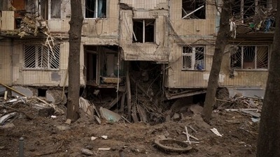 A view of a crater from an explosion near to a residential building, heavily damaged after a Russian attack in Kharkiv, Ukraine. (AP)