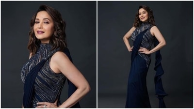 Madhuri Dixit added a fusion touch to her ethnic wear and impressed the fashion police in a blue dazzling contemporary saree.&nbsp; (Instagram/@gauravguptaofficial)