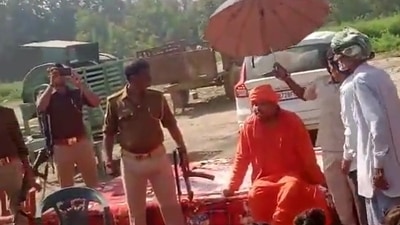 Women and children around him clapped as the Mahanta Bajrang Muni Das issued rape threats to Muslim women. (Twitter) Women and children around him clapped as the Mahanta Bajrang Muni Das issued rape threats to Muslim women. (Twitter)