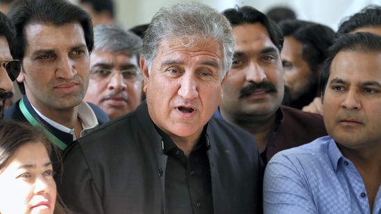 Pakistan Tehreek-e-Insaf Party leader Shah Mahmood Qureshi talks to reporters outside the Supreme Court.(AP file)