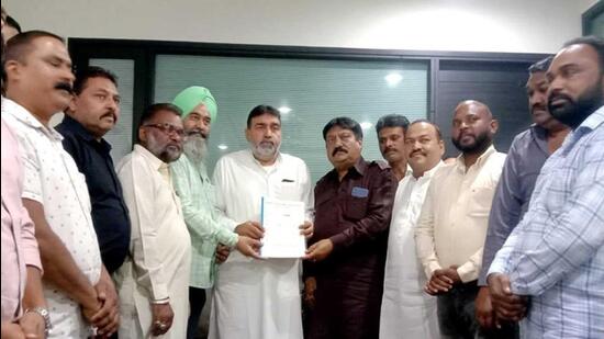 Ludhiana MC employees’ union submitted memorandums seeking regularisation with all AAP MLAs from Ludhiana. (HT Photo)