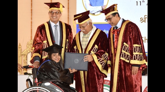 Haryana chief minister Manohar Lal Khattar presenting degree to a student during the 11th annual convocation of the Indian Institute of Management in Rohtak on Saturday. (Manoj Dhaka/HT)