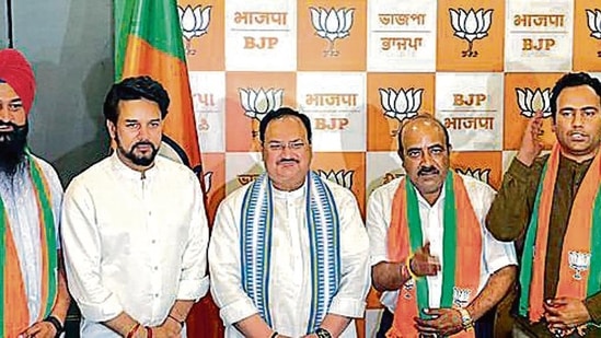 Union minister Anurag Thakur and BJP chief JP Nadda welcome new party members Anoop Kesari, Satish Thakur and Iqbal Singh, in New Delhi on Friday.&nbsp;(ANI)
