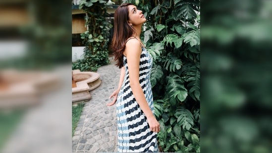 Mrunal Thakur treated her fans with beautiful pictures of herself in this flowy dress featuring double straps and stripes.(Instagram/@mrunalthakur)