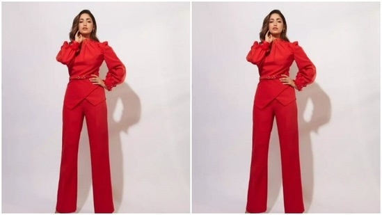 Yami paired a red top with wrapped around details with a pair of bright red trousers with wide legs. Yami’s top came with dramatic full sleeves and a belt around the waist.(Instagram/@yamigautam)