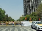 Local police install barricades to cordon off traffic during the test blast at Supertech twin towers in Noida on Sunday. (Sunil Ghosh/HT Photo)