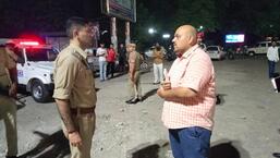 Cops at the spot in Phase-5, Mohali, where man was shot when he was out with his family. (HT Photo)