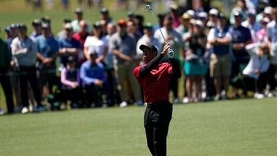Tiger Woods watches his shot on ninth hole during the final round at the Masters golf tournament on Sunday. (AP) Tiger Woods watches his shot on ninth hole during the final round at the Masters golf tournament on Sunday. (AP)