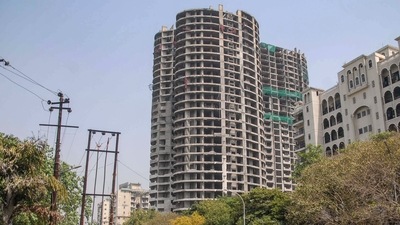 Closed road near twin residential towers of Supertech, ahead of a test blast to be conducted in Noida. (PTI) Closed road near twin residential towers of Supertech, ahead of a test blast to be conducted in Noida. (PTI)
